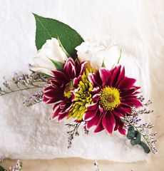 Purple daisy boutonniere